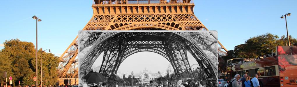 Someone holding old photograph of Eiffel Tower in front of Eiffel Tower